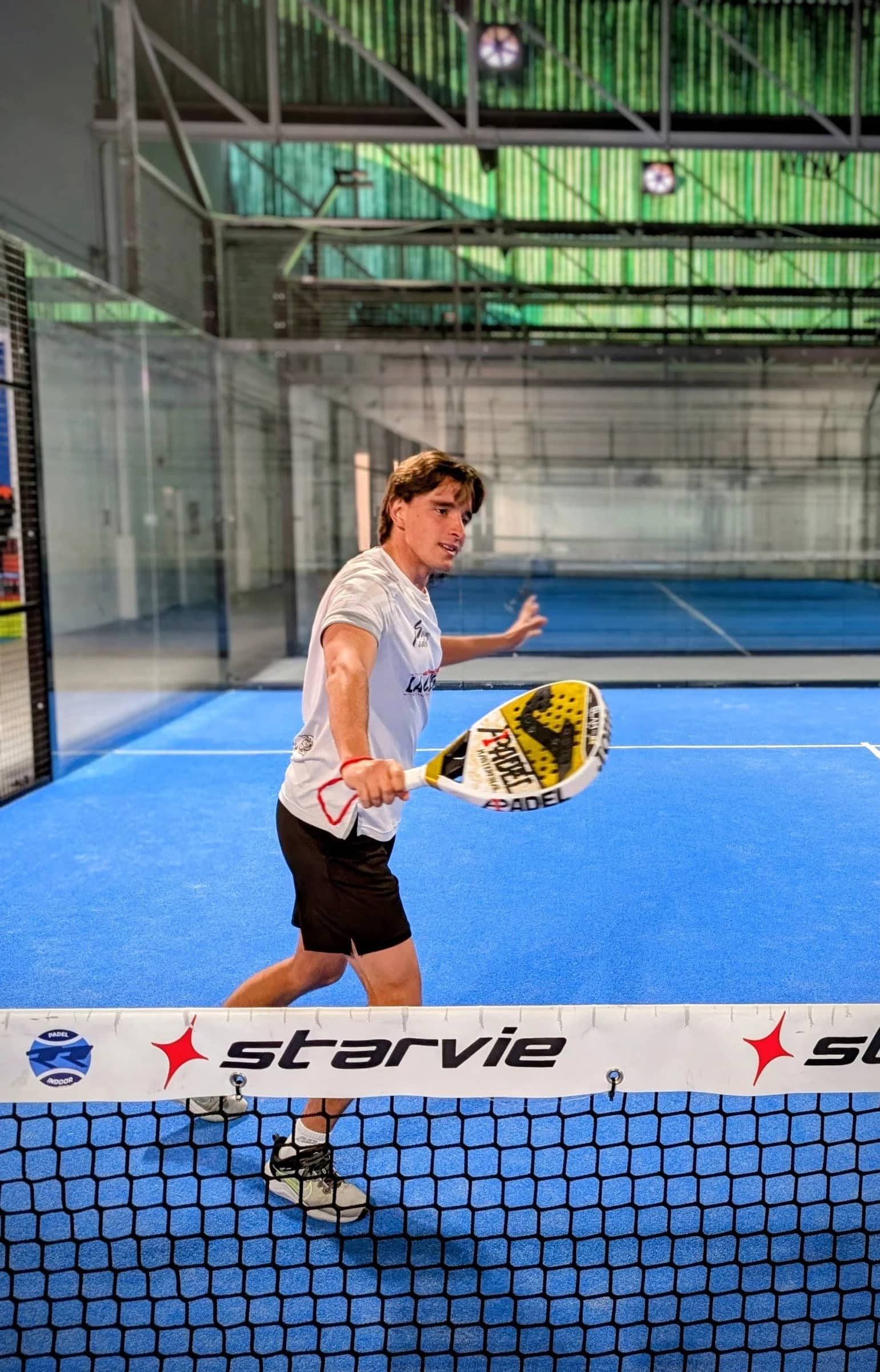 Guillermo, senior coach at Bam Bam Padel, on court in Ubud