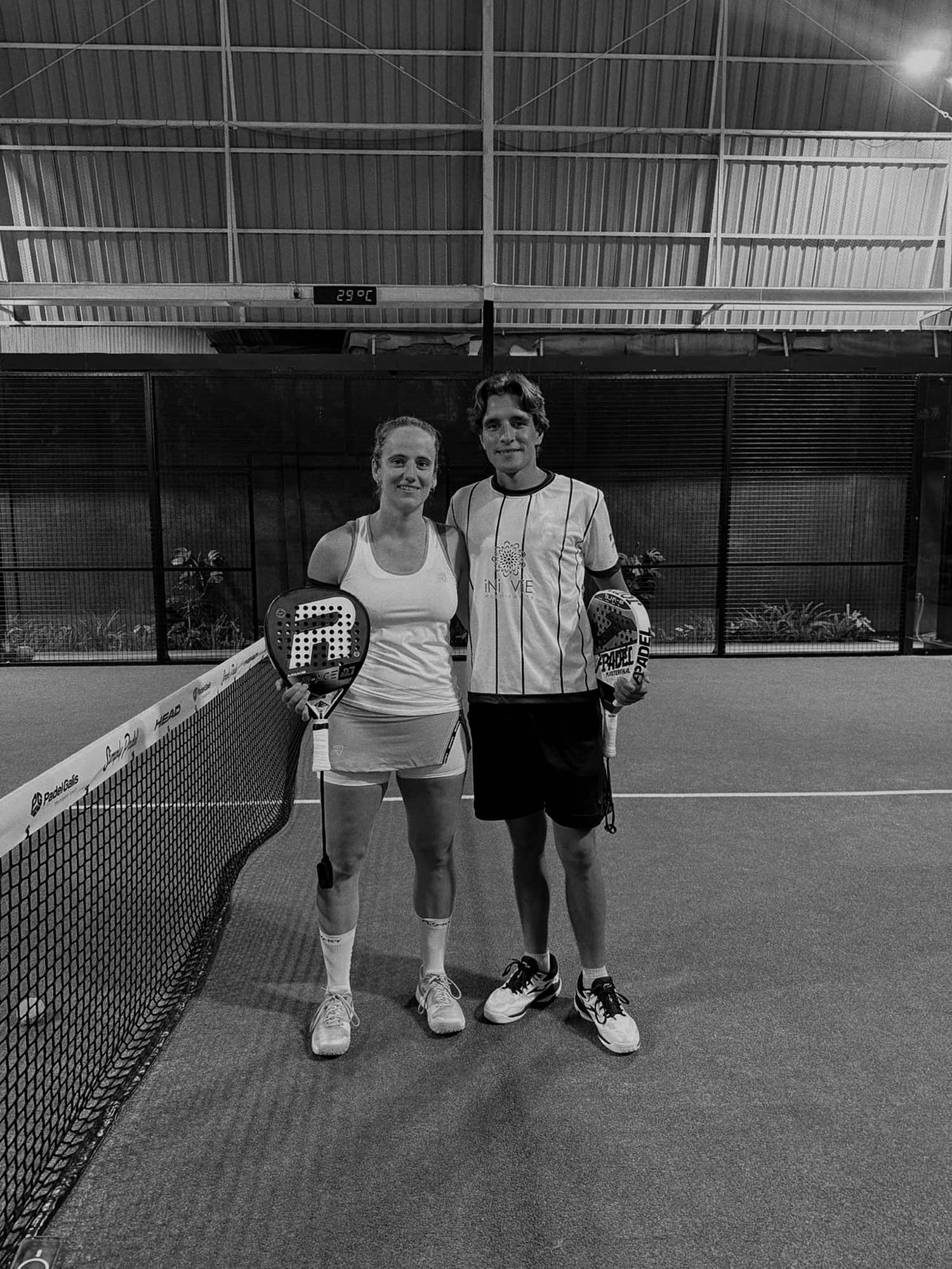 Coaches Ceres and Guillermo together at the net, two of the club's three coaches